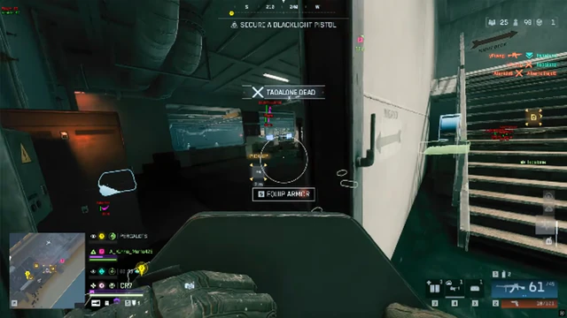 Battlefield 6 dim stairwell leading to a bright exterior bay with armor and revive prompts visible.